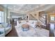 Inviting living room featuring an open layout, hardwood floors, and staircase access at 147 Johnston Farm Ln, Woodstock, GA 30188