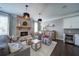 Inviting living room with a brick fireplace, stylish decor, and views into other rooms at 147 Johnston Farm Ln, Woodstock, GA 30188