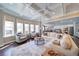 Bright and airy living room with coffered ceilings, hardwood floors, and large windows at 147 Johnston Farm Ln, Woodstock, GA 30188