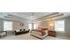 Spacious main bedroom suite with trey ceilings, sitting area, ample natural light, and a calming color palette at 147 Johnston Farm Ln, Woodstock, GA 30188