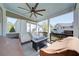 Cozy screened porch with fire pit and comfortable seating, ideal for relaxing outdoors at 147 Johnston Farm Ln, Woodstock, GA 30188
