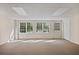Bright basement space with windows and a door; versatile room for various uses at 7700 Dunvegan Close, Atlanta, GA 30350