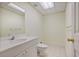 Functional bathroom includes a single sink vanity, white fixtures and a neutral color scheme at 7700 Dunvegan Close, Atlanta, GA 30350