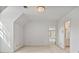 Bright bedroom with neutral carpet and fresh, white paint; bathroom access enhances convenience at 7700 Dunvegan Close, Atlanta, GA 30350