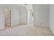 Neutral bedroom with carpet, a small accent window, and a doorway at 7700 Dunvegan Close, Atlanta, GA 30350