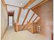 Hallway with wood banister, carpet, and exposed beams on the upper level of the home at 7700 Dunvegan Close, Atlanta, GA 30350