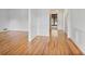 Hallway with hardwood floors and white wainscoting at 7700 Dunvegan Close, Atlanta, GA 30350