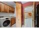 Laundry room with washer and dryer, cabinetry, and access to a kitchen at 7700 Dunvegan Close, Atlanta, GA 30350