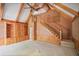 Open living room with a vaulted ceiling, built-in cabinets, and stairs leading to an upper level at 7700 Dunvegan Close, Atlanta, GA 30350