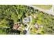 An aerial view showcasing the property's placement amongst lush green trees at 8518 Shoreview Ct, Jonesboro, GA 30236
