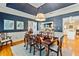 Elegant dining room with a formal table, classic chairs, and designer lighting at 8518 Shoreview Ct, Jonesboro, GA 30236