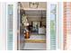 View from the open front door through the foyer to the living area with natural light at 8518 Shoreview Ct, Jonesboro, GA 30236