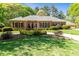 Charming single-story brick home featuring a landscaped yard and a welcoming front entrance at 8518 Shoreview Ct, Jonesboro, GA 30236