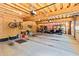 Spacious garage with exposed wood beams, a golf cart, and plenty of storage space at 8518 Shoreview Ct, Jonesboro, GA 30236
