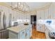Spacious kitchen with center island, modern appliances, and hardwood flooring at 8518 Shoreview Ct, Jonesboro, GA 30236