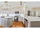 Modern kitchen with stainless steel appliances, granite counters, and an open layout at 8518 Shoreview Ct, Jonesboro, GA 30236
