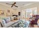 Bright living room featuring neutral tones, ample seating, and a stylish front door at 8518 Shoreview Ct, Jonesboro, GA 30236