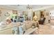 Bright living room featuring travertine floors, custom built ins and stylish decor at 8518 Shoreview Ct, Jonesboro, GA 30236