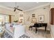 Bright living room with a piano, sofa, and natural light from the surrounding property at 8518 Shoreview Ct, Jonesboro, GA 30236