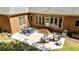 A spacious brick patio featuring a dining area, outdoor seating, and a grill perfect for entertaining at 8518 Shoreview Ct, Jonesboro, GA 30236