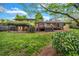 Lush backyard featuring a large deck, a charming patio, and mature landscaping at 2921 Country Squire Ln, Decatur, GA 30033