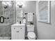 Modern bathroom featuring a glass enclosed shower, white vanity, and modern fixtures at 2921 Country Squire Ln, Decatur, GA 30033