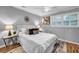 Bedroom with hardwood floors, a white ceiling fan, large windows with natural light, and a plush rug at 2921 Country Squire Ln, Decatur, GA 30033