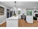 Bright kitchen features white cabinets, quartz counters, stainless appliances, and hardwood floors at 2921 Country Squire Ln, Decatur, GA 30033