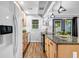 Kitchen featuring stainless steel appliances, granite countertops, light wood cabinets, and modern lighting fixtures at 2921 Country Squire Ln, Decatur, GA 30033