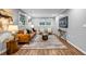 Cozy living room with neutral paint, recessed lighting, and hardwood floors with modern decor at 2921 Country Squire Ln, Decatur, GA 30033