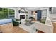 Bright living room featuring hardwood floors, fireplace, modern furniture, and sliding glass door at 2921 Country Squire Ln, Decatur, GA 30033