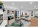 Cozy living room with fireplace, comfortable seating, and ample natural light and hardwood floors at 2921 Country Squire Ln, Decatur, GA 30033