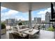 Relaxing balcony with comfortable seating and stunning city skyline views at 3107 Peachtree Ne Rd # 1403, Atlanta, GA 30305