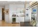 Elegant bar area featuring a wine refrigerator and glass shelving, perfect for entertaining guests at 3107 Peachtree Ne Rd # 1403, Atlanta, GA 30305