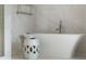 Close up of modern standalone tub situated next to a tiled shower with glass enclosure at 3107 Peachtree Ne Rd # 1403, Atlanta, GA 30305