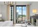 Bedroom view showcasing floor to ceiling windows with lovely city views and chic interior design at 3107 Peachtree Ne Rd # 1403, Atlanta, GA 30305