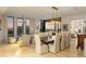 Bright dining and living room area with city views, natural light, modern decor and beautiful hardwood flooring at 3107 Peachtree Ne Rd # 1403, Atlanta, GA 30305