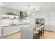 Modern kitchen with an island and seating, stainless steel appliances, and lots of counter space at 3107 Peachtree Ne Rd # 1403, Atlanta, GA 30305