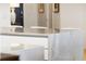 A kitchen island featuring a countertop with marble and plenty of cabinet space for storage at 3107 Peachtree Ne Rd # 1403, Atlanta, GA 30305