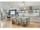 Modern kitchen featuring an island with seating, modern appliances, and views into the dining area at 3107 Peachtree Ne Rd # 1403, Atlanta, GA 30305