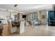 Open-concept living space with a dining area, bar and access to a balcony with city views at 3107 Peachtree Ne Rd # 1403, Atlanta, GA 30305