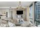 Stylish living room with a sleek fireplace, large windows, and comfortable seating arrangements at 3107 Peachtree Ne Rd # 1403, Atlanta, GA 30305