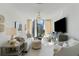 Bright living room featuring comfortable seating, city views, and a TV at 3107 Peachtree Ne Rd # 1403, Atlanta, GA 30305