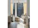 Bright living room with floor to ceiling windows and city views at 3107 Peachtree Ne Rd # 1403, Atlanta, GA 30305