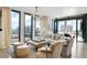 Bright living room features floor-to-ceiling windows, plush seating, and city views at 3107 Peachtree Ne Rd # 1403, Atlanta, GA 30305