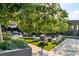 Serene outdoor lounge area with comfortable seating nestled amidst lush greenery and decorative stone at 3107 Peachtree Ne Rd # 1403, Atlanta, GA 30305