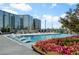 Beautiful rooftop pool with seating and vibrant floral arrangements, and stunning city views at 3107 Peachtree Ne Rd # 1403, Atlanta, GA 30305