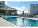 Modern rooftop pool with inviting lounge areas, offering a serene escape with city views at 3107 Peachtree Ne Rd # 1403, Atlanta, GA 30305