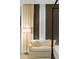 Close up shot of a sitting area in the main bedroom with neutral colored walls and decor at 3107 Peachtree Ne Rd # 1403, Atlanta, GA 30305
