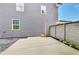 Backyard patio with gray siding and partial fence detail at 89 Little Magnolia Ln, Auburn, GA 30011